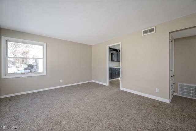 empty room with carpet flooring