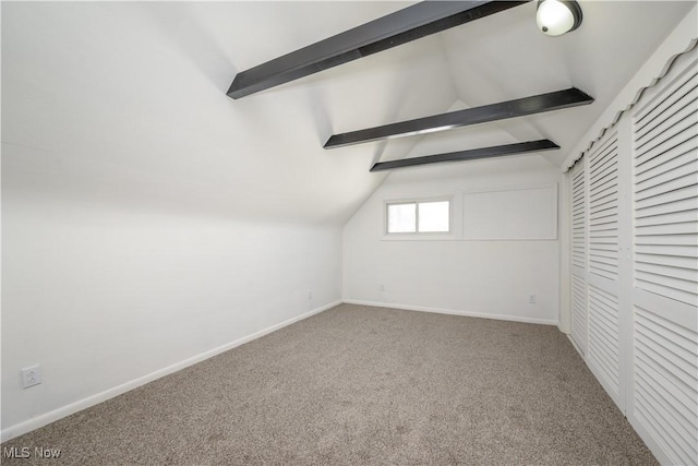 additional living space with carpet floors and vaulted ceiling with beams