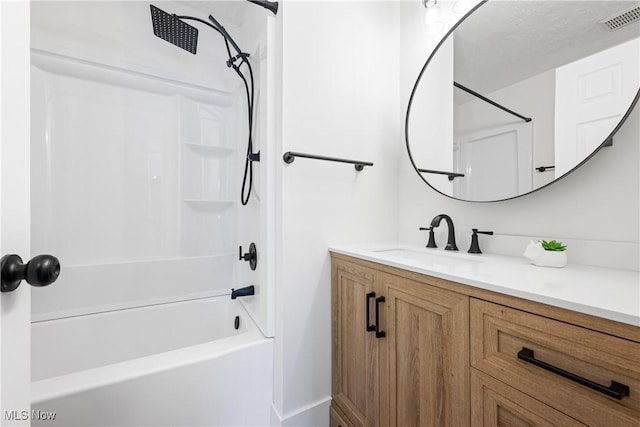 bathroom featuring vanity and shower / bathtub combination