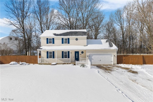 view of front of home with a garage and a porch