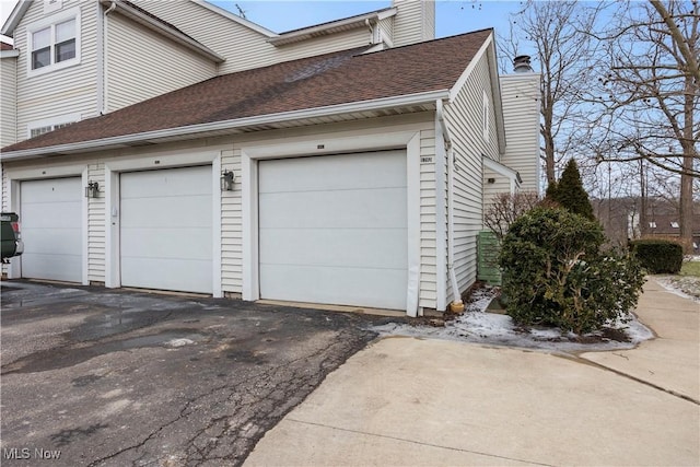 view of property exterior with a garage