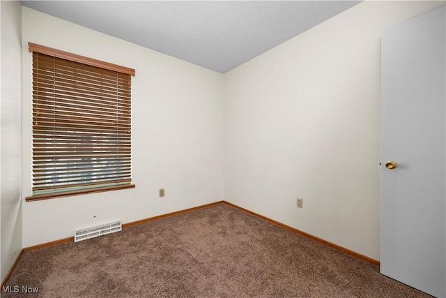 empty room featuring carpet flooring