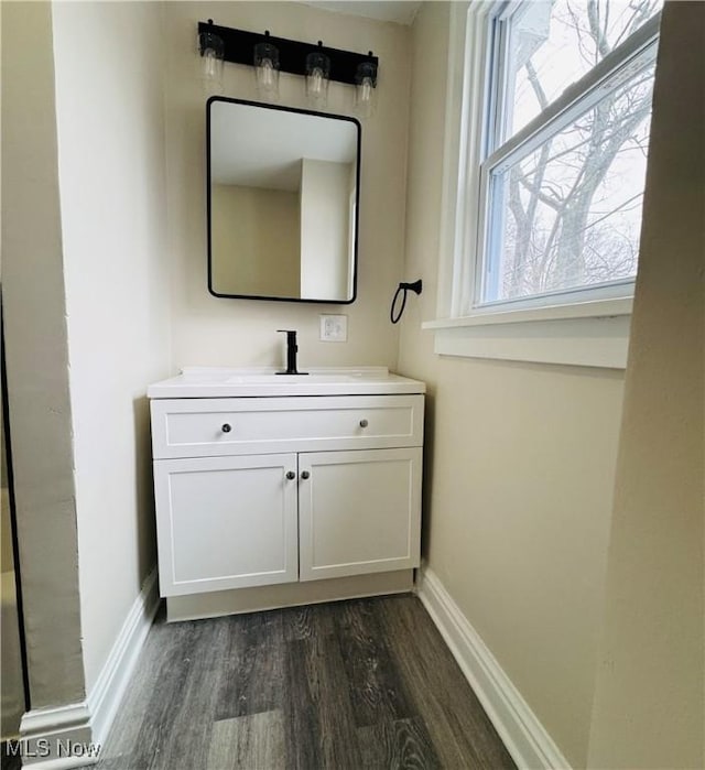 bathroom with vanity and wood-type flooring