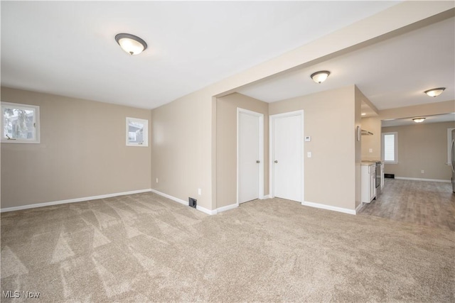 empty room with light colored carpet