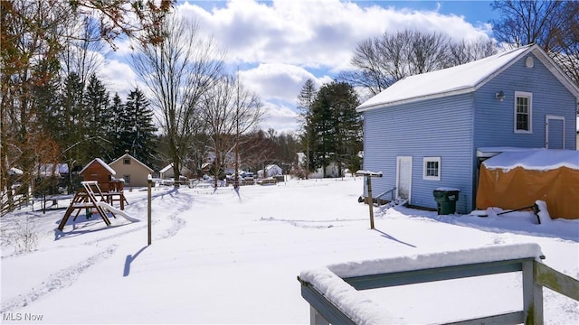 view of yard covered in snow