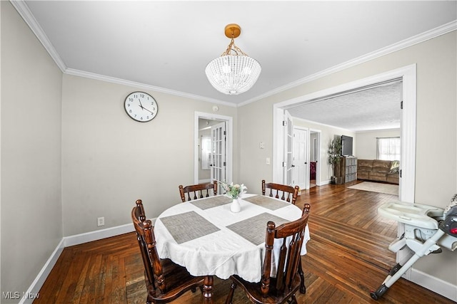 dining room with dark wood-type flooring, crown molding, and a chandelier