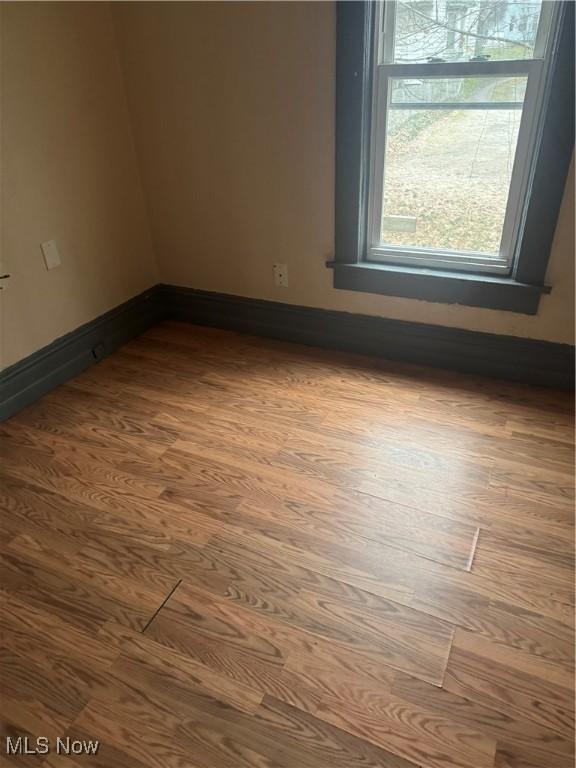 549 Hazel Pl, Akron, OH 44304 - spare room featuring hardwood / wood-style floors