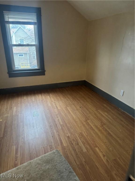 549 Hazel Pl, Akron, OH 44304 - additional living space with lofted ceiling and hardwood / wood-style floors
