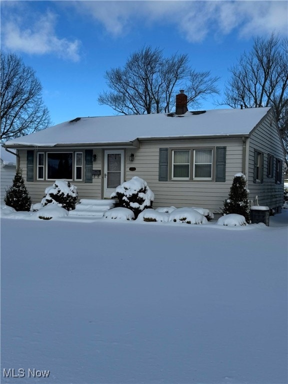 ranch-style home featuring central AC unit