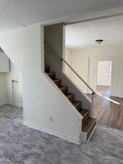 stairway featuring wood-type flooring