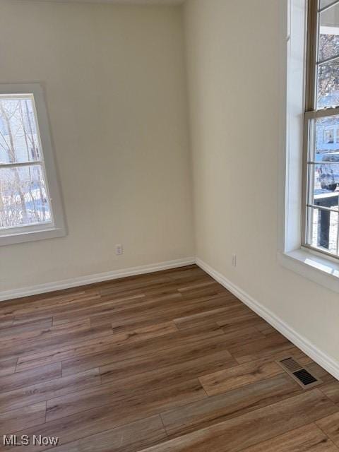 empty room featuring dark hardwood / wood-style floors