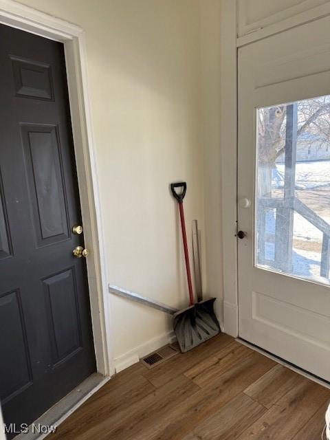 doorway to outside featuring hardwood / wood-style flooring