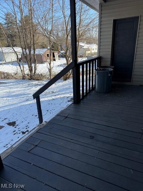 view of snow covered deck