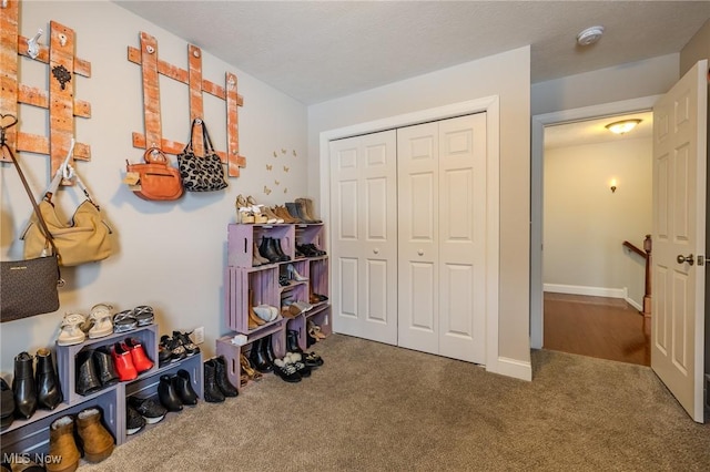 interior space featuring a textured ceiling and a closet