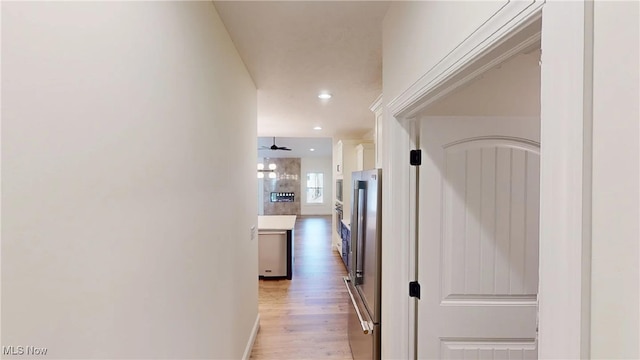 hall with hardwood / wood-style flooring