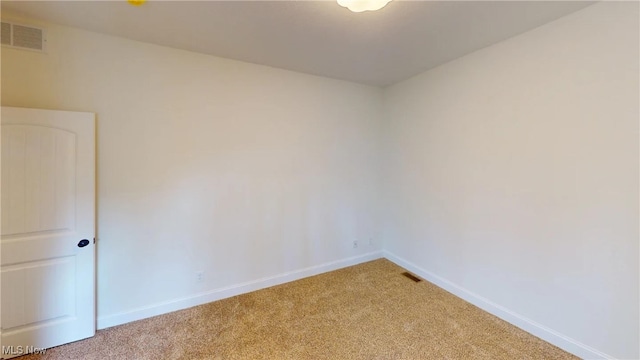 spare room with carpet floors