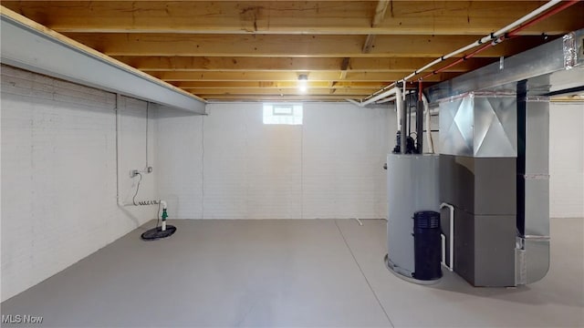 basement featuring heating unit and gas water heater