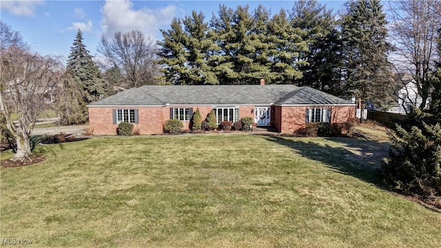 ranch-style house with a front lawn