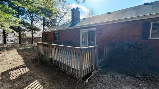 back of house with a wooden deck