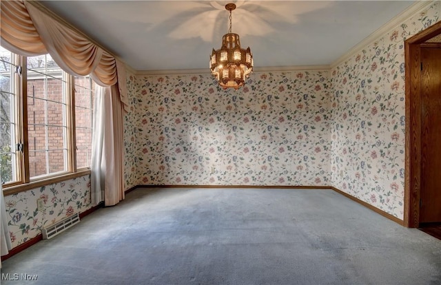 unfurnished room with ornamental molding, carpet flooring, and a chandelier