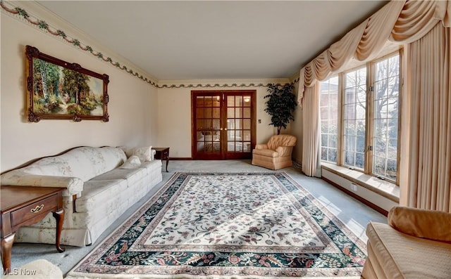 living area featuring light carpet and french doors