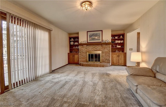 unfurnished living room with a fireplace, built in shelves, and light colored carpet