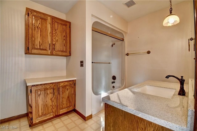 bathroom featuring shower / bath combination and vanity