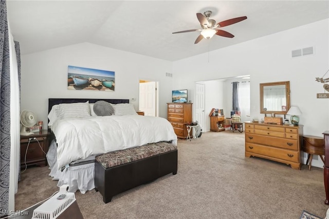 carpeted bedroom featuring lofted ceiling and ceiling fan