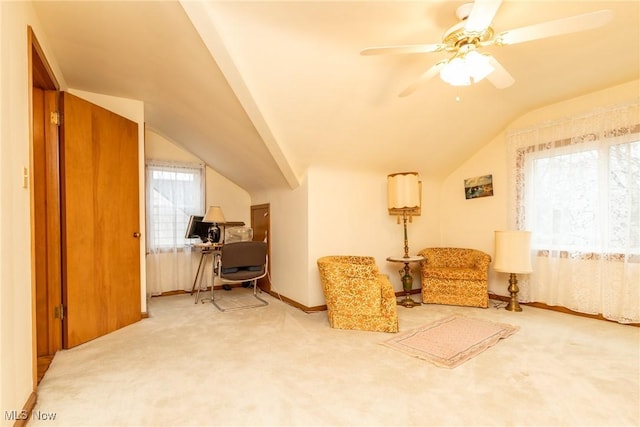 sitting room with ceiling fan, vaulted ceiling, and carpet floors