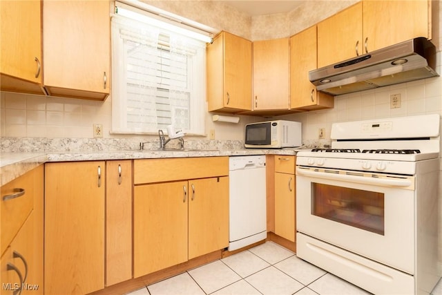 kitchen with white appliances, light tile patterned floors, and backsplash