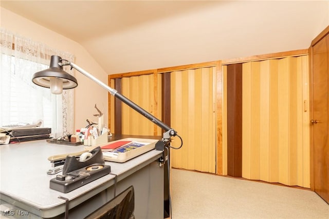 office area featuring vaulted ceiling and light colored carpet