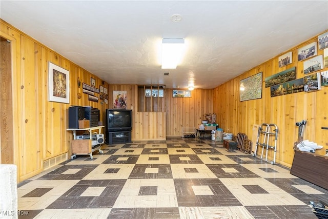 interior space featuring wooden walls