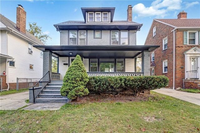 view of front facade featuring a front yard and a porch