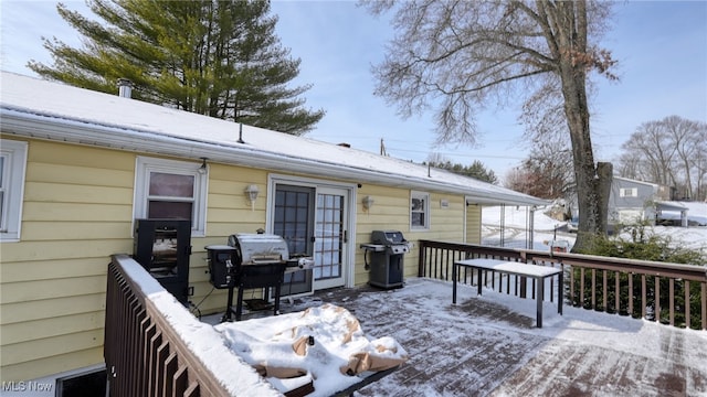 snow covered deck with grilling area