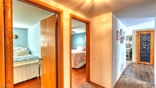 hall with dark hardwood / wood-style floors