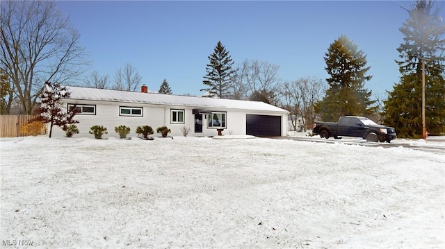 ranch-style house featuring a garage