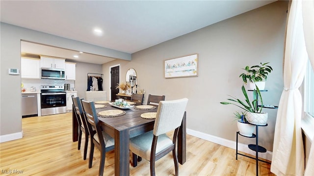 dining room with light hardwood / wood-style floors