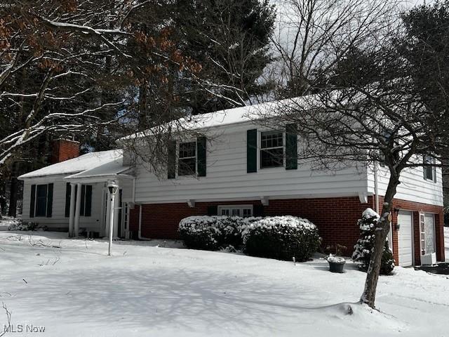 view of snow covered property