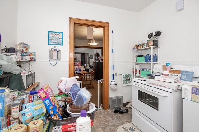 kitchen with tile walls and white electric range oven