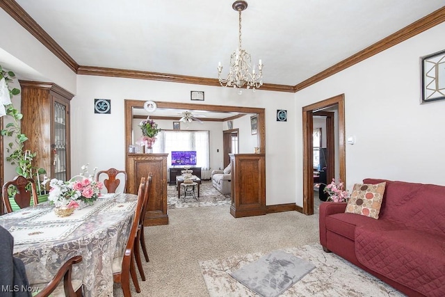 carpeted dining room with a chandelier and ornamental molding