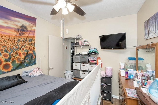 bedroom featuring parquet floors and ceiling fan