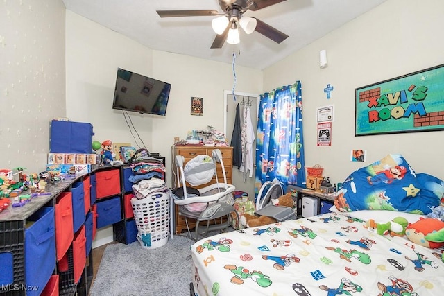 bedroom with ceiling fan and carpet floors