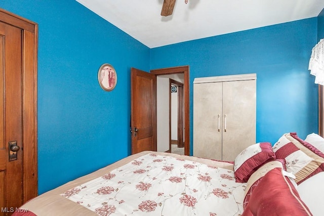 unfurnished bedroom featuring a closet and ceiling fan