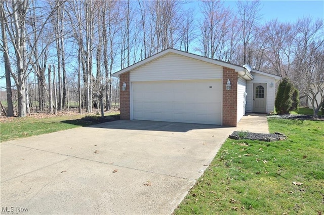 garage featuring a lawn