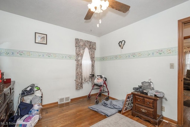 376 E 330th St, Willowick, OH 44095 - bedroom featuring wood finished floors, baseboards, ceiling fan, and visible vents