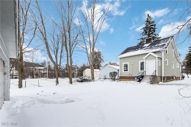 view of yard covered in snow