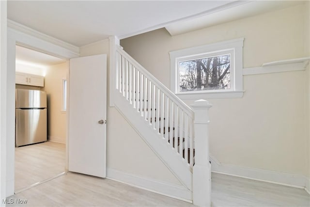 stairs with hardwood / wood-style floors