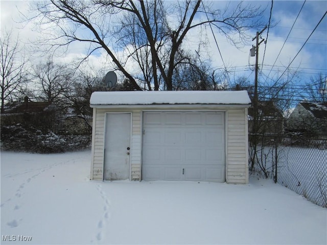 view of snow covered garage