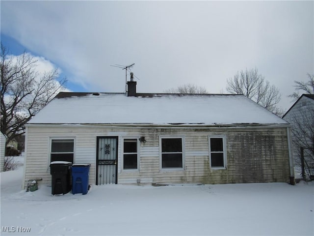 view of snow covered house