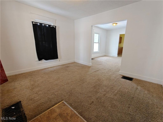 empty room with carpet flooring